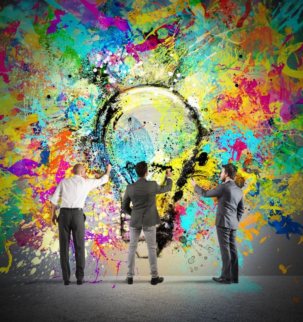 Image of people painting a light bulb mural together